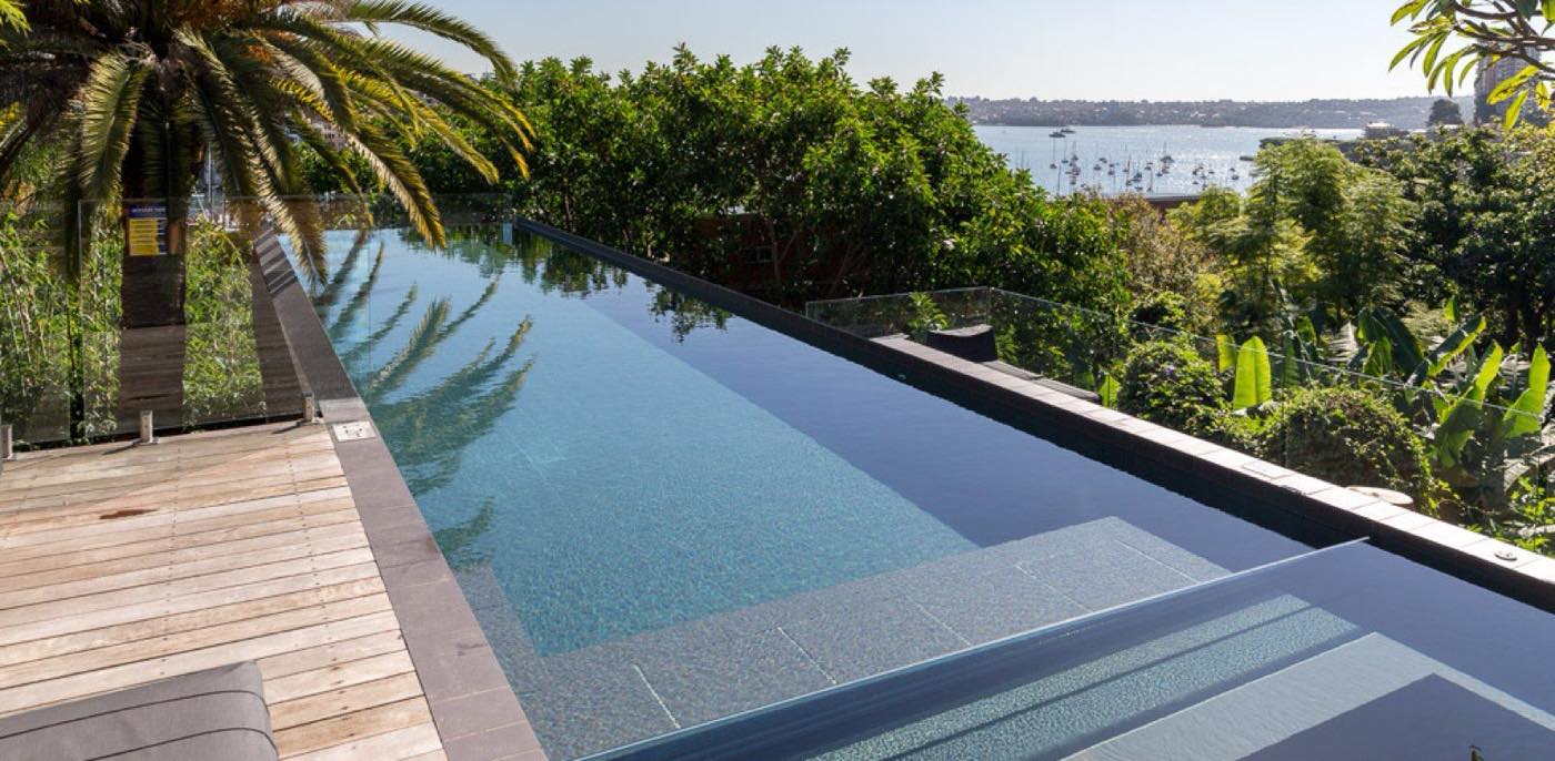 Infinity-edge concrete pool by Wright Pools overlooking Sydney Harbour at Darling Point